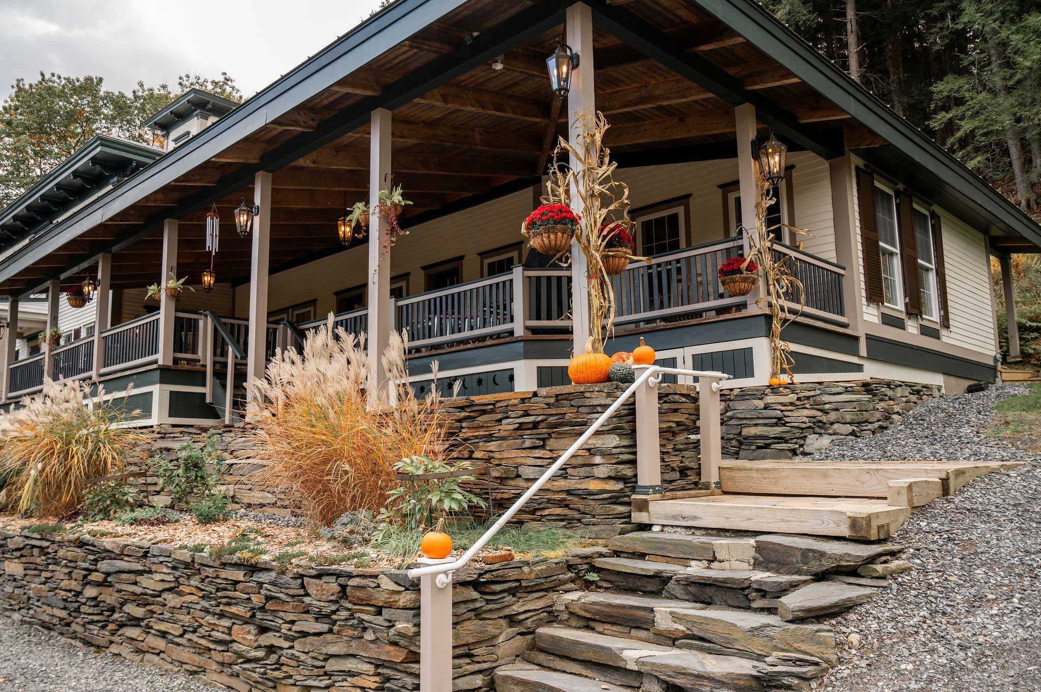 stone stairs leading up past the corner of the house and veranda